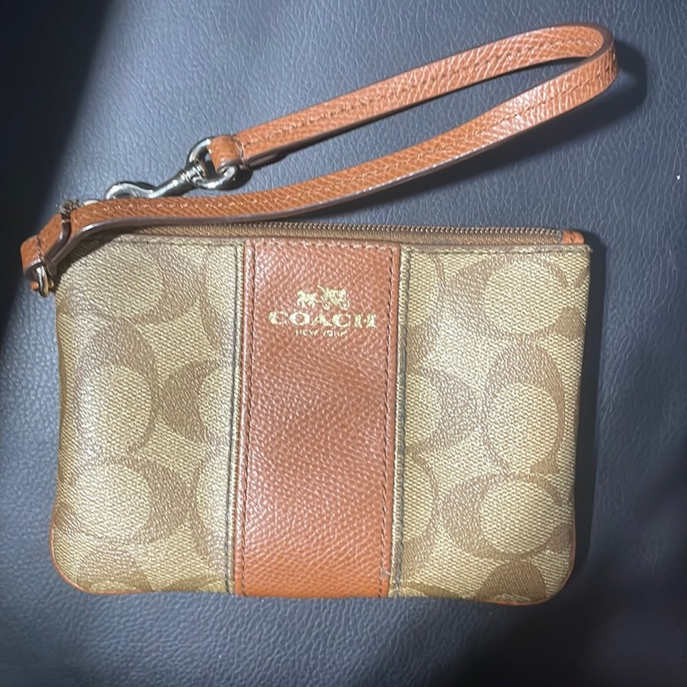 Coach Coin Purse with hand strap.